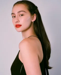 Lola Tung in black