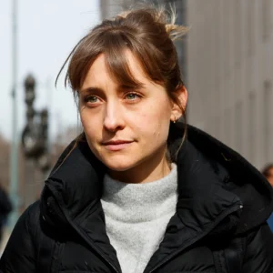 Allison Mack in a black jacket