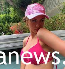 Iris Apatow in a pink bikini with a hat
