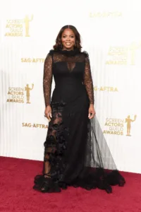 Janelle James in a black gown