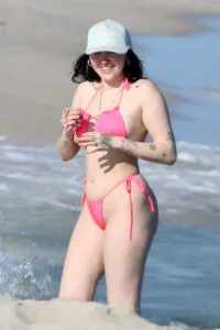 Noah Cyrus in a pink bikini