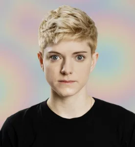 Mae Martin in black