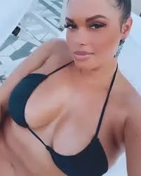 Joy Taylor in a black bikini