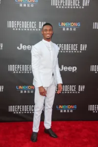 Jessie T. Usher in white