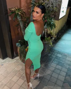 Joy Taylor in a green dress