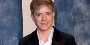 Mae Martin in a suit