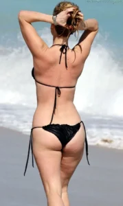 Alice Eve in a black bikini