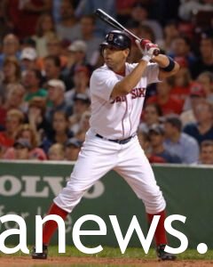 Alex Cora playing baseball