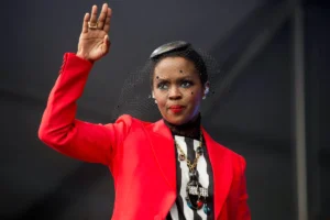 Lauryn Hill in a red blazer