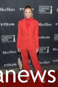 Maria Bello in a power suit