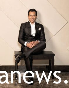 Rahul Khanna in a classic black suit
