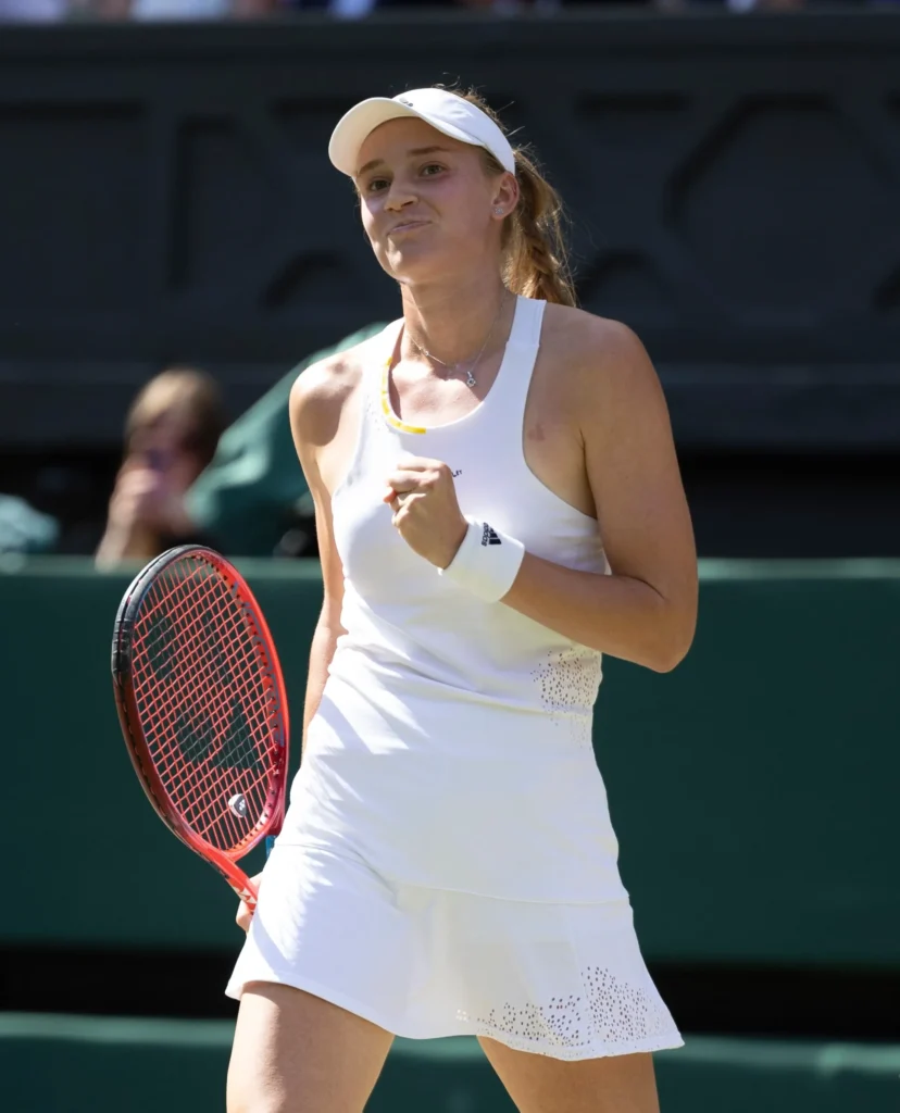 Elena Rybakina in a white tennis dress