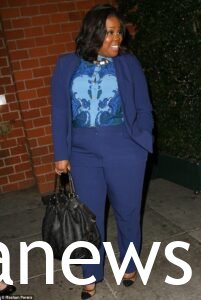 Amber Riley in a power suit