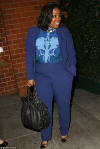 Amber Riley in a power suit