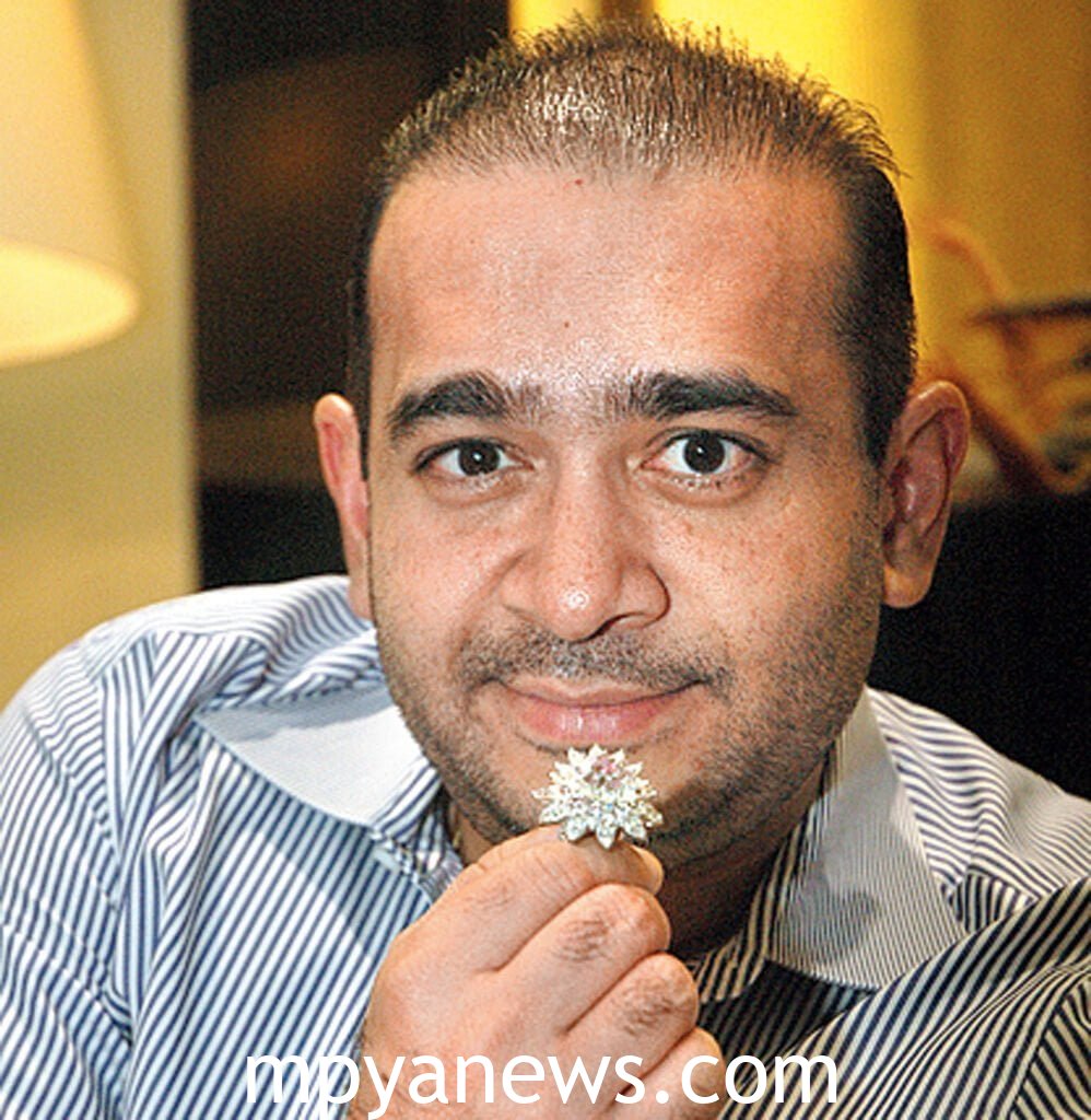 Nirav Modi holding flowers