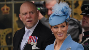 Zara Tindall: on a sky blue dress with ,ike on a black suit
