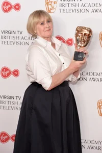 Sarah Lancashire holding an award