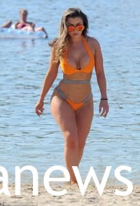 Abigail Clarke in a yellow bikini