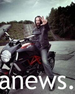 Keanu Reeves: on a big bike ,black