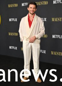 Jonathan Bailey in a white suit