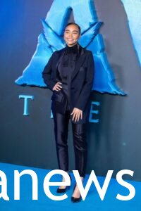 Bailey Bass in a black pantsuit