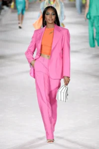 Naomi Campbell in a pink pantsuit