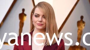 Emma Stone with her maroon dress
