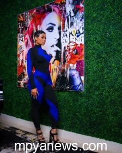 Blac Chyna: on a black and blue jumpsiut