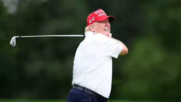 Donald Trump Hobbies:in white playing golf