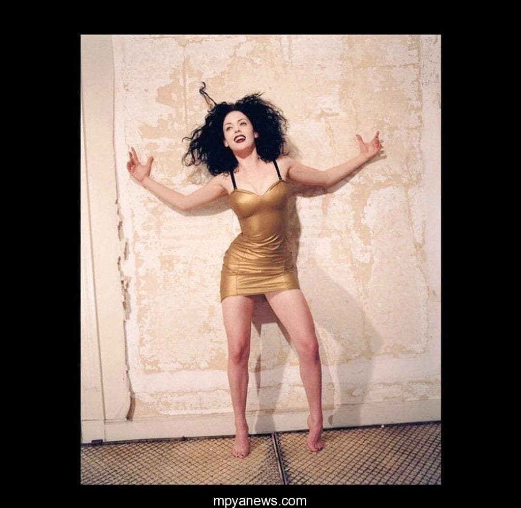 Rose McGowan: on a gold ,sexy dress