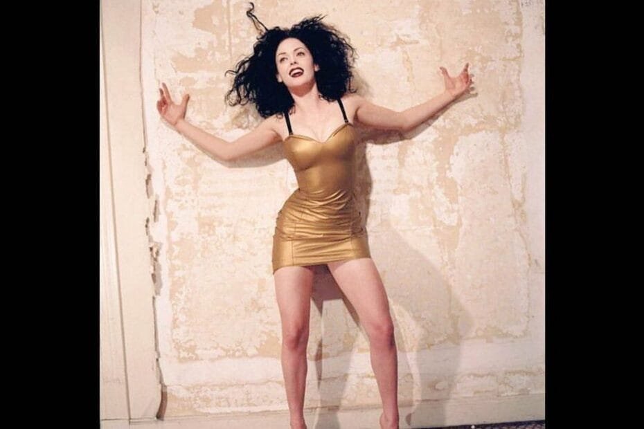Rose McGowan: on a gold ,sexy dress