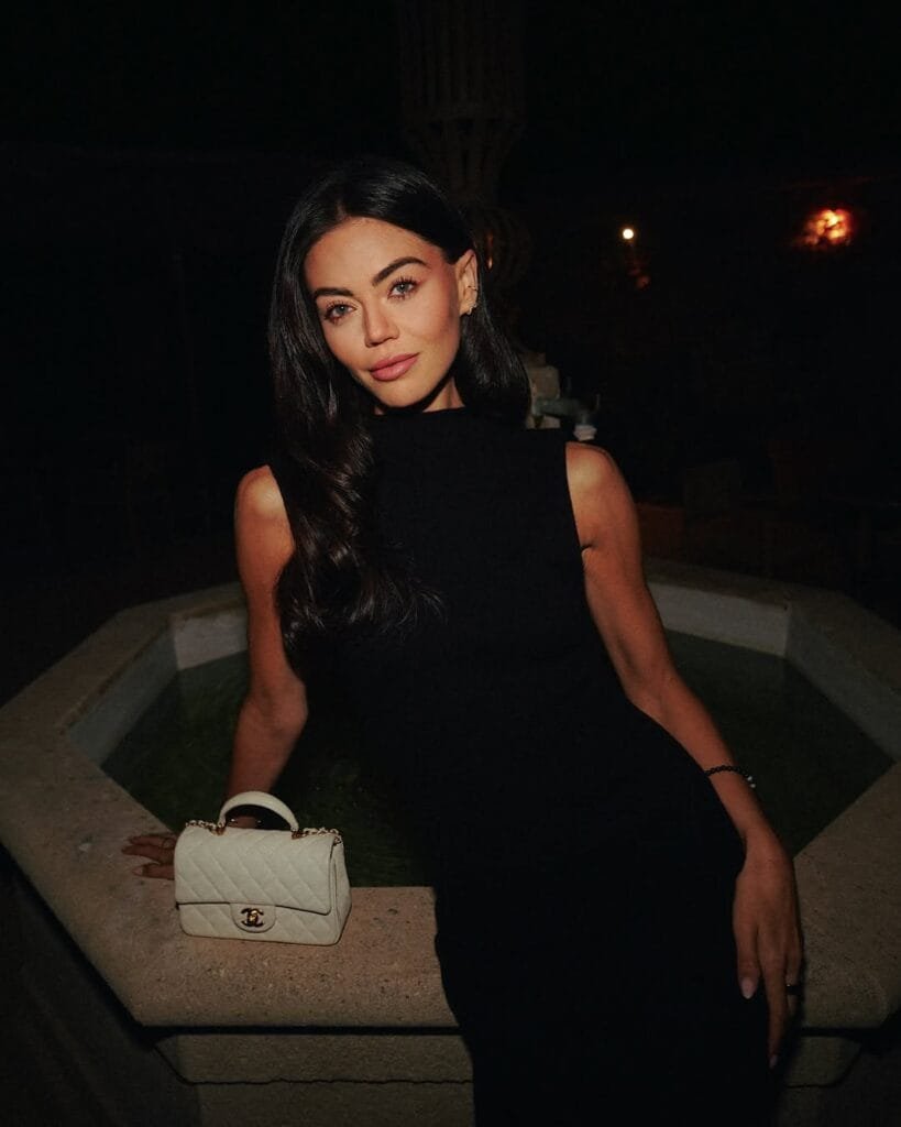 Emily Canham:in a black dress