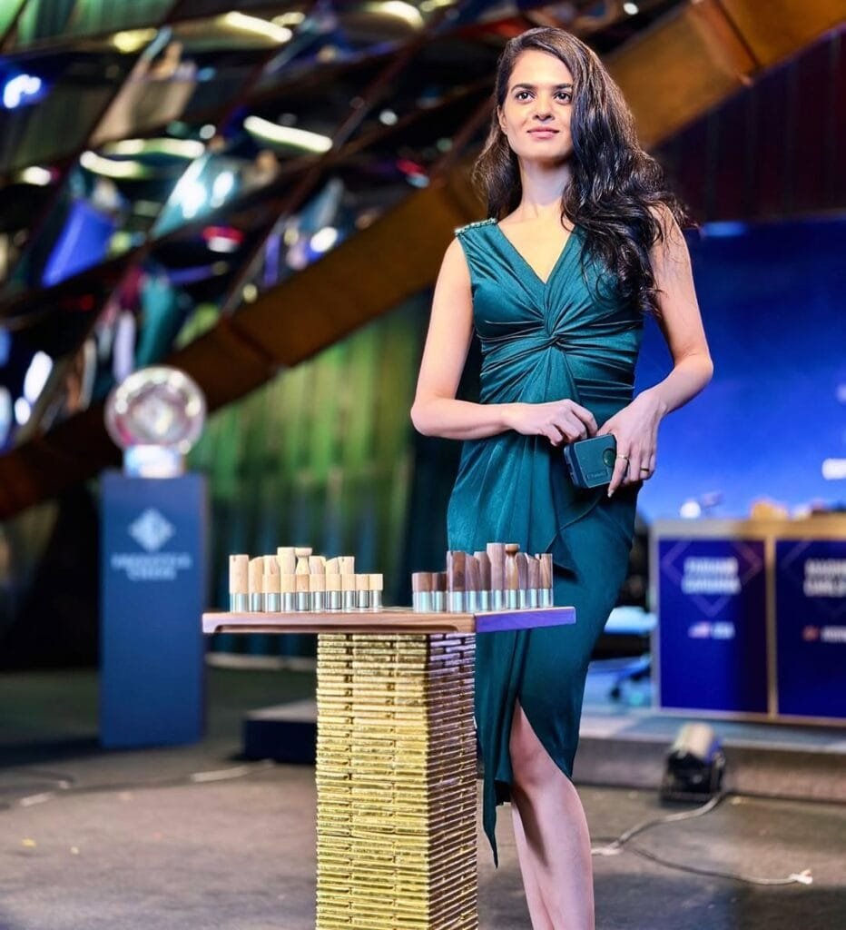 Tania Sachdev:in a green dress