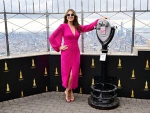 Elizabeth Hurley's hobbies:in a pink high slit dress