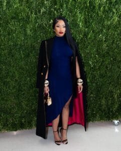 Nicki Minaj's net worth:in a blue high slit dress